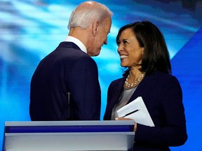 In this Sept. 12, 2019, file photo, former vice-president Joe Biden talks with Senator Kamala Harris after the conclusion of the 2020 Democratic U.S. presidential debate in Houston, Texas.