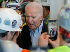 Democratic U.S. presidential candidate and former Vice President Joe Biden argues with a worker as he defends his positions on gun control during a Biden campaign stop at the FCA (Fiat Chrysler Automobiles) Mack Assembly plant in Detroit, Michigan, U.S., March 10, 2020.