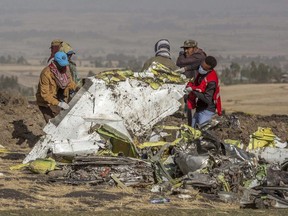 In this March 11, 2019, file photo, rescuers work at the scene of an Ethiopian Airlines flight crash outside of Addis Ababa, Ethiopia.