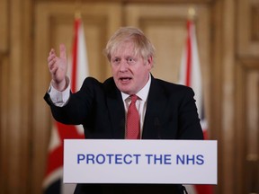 Prime Minister Boris Johnson speaks during a news conference on the ongoing situation with the coronavirus in London March 22, 2020. (Ian Vogler/Pool via REUTERS)