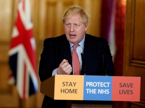 Britain's Prime Minister Boris Johnson speaks during his first remote news conference on the coronavirus disease (COVID-19) outbreak, in London March 25, 2020. Andrew Parsons/10 Downing Street/Handout