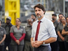 Canada's Prime Minister Justin Trudeau takes questions from the media as he visits auto parts company ABC Technologies to talk about the USMCA trade agreement, in Brampton, Ontario, Canada January 30, 2020.