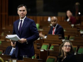 Minister of Finance Bill Morneau speaks in the House of Commons as legislators convene to give the government power to inject billions of dollars in emergency cash to help individuals and businesses through the economic crunch caused by the novel coronavirus outbreak, on Parliament Hill in Ottawa on March 25, 2020.