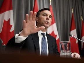 Minister of Finance Bill Morneau speaks during a press conference on economic support for Canadians impacted by COVID-19, at West Block on Parliament Hill in Ottawa, on Wednesday, March 18, 2020.(THE CANADIAN PRESS/Justin Tang)