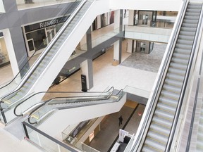 A man walks through a shopping mall in downtown Montreal, Wednesday, March 18, 2020, as COVID-19 cases rise in Canada and around the world.