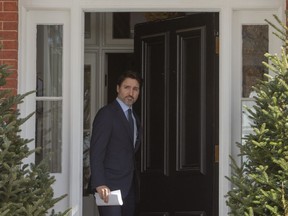 Prime Minister Justin Trudeau emerges from Rideau Cottage to hold a news conference in Ottawa, on Friday, March 13, 2020.