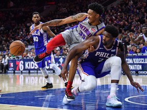 Detroit Pistons forward Christian Wood (35) and Philadelphia 76ers centre Joel Embiid (21) get tangled up at Wells Fargo Center.  (Eric Hartline-USA TODAY Sports)