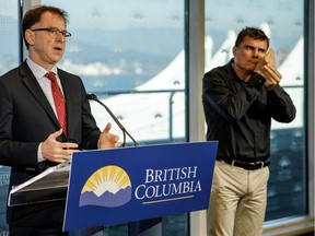 Health Minister Adrian Dix and deaf interpreter Nigel Howard.