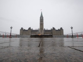 Parliament Hill is seen without any visitors in Ottawa, Monday March 23, 2020.