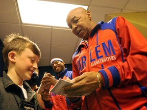 Harlem Globetrotters retired legend Curly Neal visits fans at Rexall Place to sign autographs. (SHAUGHN BUTTS/Postmedia)
