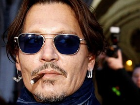 Actor Johnny Depp leaves the High Court in London, Britain, February 26, 2020. (REUTERS/Henry Nicholls)