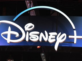 A Disney+ streaming service sign is pictured at the D23 Expo, billed as the "largest Disney fan event in the world," at the Anaheim Convention Center in Anaheim, Calif., on Aug. 23, 2019.