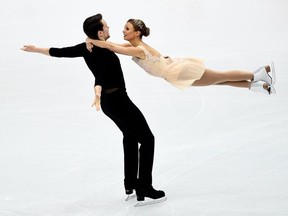Canada's Kirsten Moore-Towers and Michael Marinaro in action during the pairs free skating .