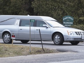 A hearse leaves with another casualty of COVID-19 at Pinecrest Nursing Home in Bobcaygeon, Ont., on Tuesday March 31, 2020.