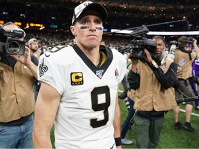 New Orleans Saints quarterback Drew Brees reacts after an overtime loss to the Minnesota Vikings in a NFC Wild Card playoff football game at the Mercedes-Benz Superdome.