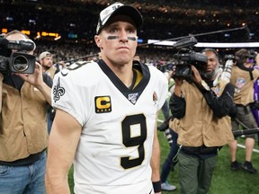 New Orleans Saints quarterback Drew Brees reacts after an overtime loss to the Minnesota Vikings in a NFC Wild Card playoff football game at the Mercedes-Benz Superdome.