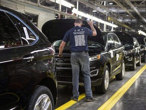 Ford Edges sit on a production line as Ford Motor Company celebrates the global production start of the 2015 Ford Edge at the Ford Assembly Plant in Oakville, Ont., on Thursday, Feb. 26, 2015.