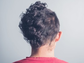 Rear view of man with funny haircut