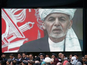 A screen shows the broadcast of Afghanistan's President Ashraf Ghani speaking during his inauguration as president, in Kabul, Afghanistan March 9, 2020.