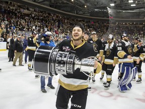 Sam Jardine hoists the Kelly Cup after the Newfoundland Growlers won the ECHL championship last year. The Growlers won't get a chance to defend their title this season. (Jeff Parsons/Newfoundland Growlers)