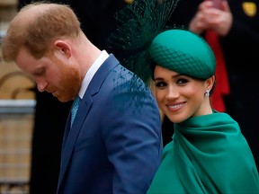 In this file photo Prince Harry, Duke of Sussex, (L) and Meghan, Duchess of Sussex arrive to attend the annual Commonwealth Service at Westminster Abbey in London on March 9, 2020.