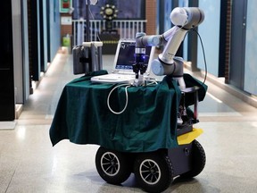 A robot designed to help medical workers treat coronavirus patients remotely is seen, after having been placed for pictures, during a demonstration for the media at the aerospace engineering school of Tsinghua University in Beijing, China March 4, 2020.