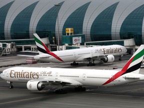 Emirates Boeing 777-300ER planes at Dubai International Airport in Dubai, United Arab Emirates, February 15, 2019.