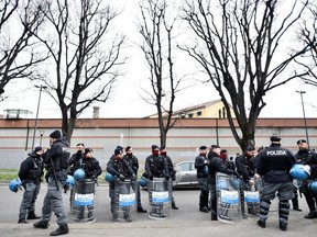Police is seen near San Vittore Prison during a revolt by inmates after family visits were suspended due to fears over coronavirus contagion, in Milan, Italy March 9, 2020.