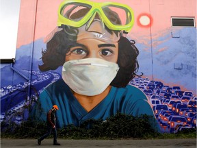 The mural "My Child, Our Air" by Craig Cundiff is pictured in Seattle's Georgetown neighbourhood as efforts continue to help slow the spread of coronavirus disease (COVID-19) in Seattle, Washington, March 24, 2020.  (REUTERS/Jason Redmond)