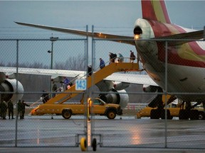 Passengers from the Grand Princess cruise ship, which was barred from returning to San Francisco last week due to a coronavirus outbreak on board, arrive at Trenton Air Force base in Ontario, Canada, March 10, 2020.