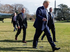 U.S. President Donald Trump is followed by Anthony Fauci, director of National Institute of Allergy and Infectious Diseases, and Health and Human Services (HHS) Secretary Alex Azar as they return to the White House from a coronavirus briefing in Washington, U.S., March 3, 2020.