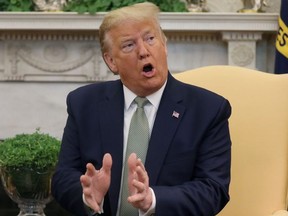U.S. President Donald Trump answers questions from the news media during his meeting with Ireland's Prime Minister, Taoiseach Leo Varadkar, in the Oval Office of the White House in Washington, U.S., March 12, 2020.