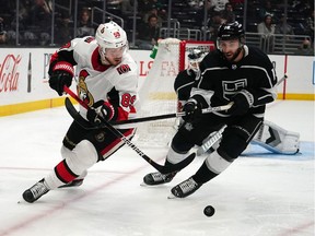 Mar 11, 2020; Los Angeles, California, USA; Ottawa Senators left wing Mikkel Boedker (89) and Los Angeles Kings center Michael Amadio (10) battle for the puck in the third period at Staples Center. The Kings won 3-2.