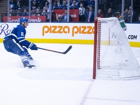 Toronto Maple Leafs winger Zach Hyman scores an empty-net goal against the Vancouver Canucks on Saturday at Scotiabank Arena in Toronto.