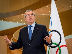 In this file photo taken on March 3, 2020 International Olympic Committee (IOC) President Thomas Bach delivers a statement on the COVID-19 situation during a meeting of the executive board at the IOC headquarters in Lausanne. (FABRICE COFFRINI/AFP via Getty Images)