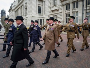 The Irish Guards parade to mark St. Patrick's Day in central London on Sunday, March 15, 2020.