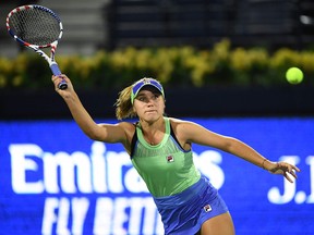 In this Feb. 18, 2020, file photo, Sofia Kenin of the U.S. returns the ball to Kazakhstan's Elena Rybakina during the WTA Dubai Duty Free Tennis Championship, at the Dubai Tennis Stadium in the United Arab Emirates.