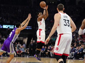 Raptors guard Kyle Lowry (7) shoots the ball over Kings guard Cory Joseph (9) during second quarter NBA action at Golden 1 Center in Sacramento, Calif., on Sunday, March 8, 2020.