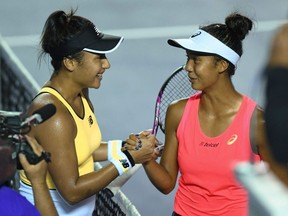 British tennis player Heather Watson (left) shakes hands with Canada's Leylah Fernandez (right) after winning the Mexican Tennis Open in Acapulco, Mexico, on Feb. 29, 2020.