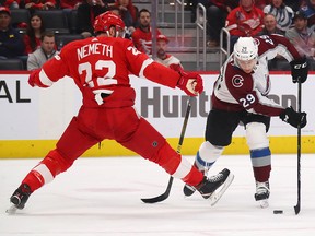Nathan MacKinnon of the Colorado Avalanche tries to avoid the foot of Patrik Nemeth of the Detroit Red Wings at Little Caesars Arena on March 2, 2020 in Detroit. (Gregory Shamus/Getty Images)