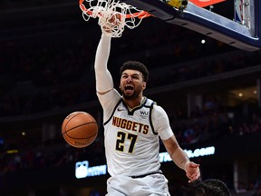 Denver Nuggets guard Jamal Murray scores a backet in the third quarter of a game against the Milwaukee Bucks at the Pepsi Center in Denver, Colo., on March 9, 2020.