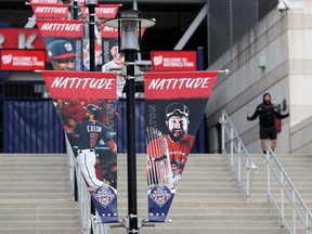 A person exercises outside Nationals Park as the stadium sits empty on the scheduled date for Opening Day March 26, 2020 in Washington. (Win McNamee/Getty Images)