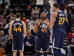 Utah Jazz guard Donovan Mitchell (45) and centre Rudy Gobert (27) talk as forward Bojan Bogdanovic (44) prepares to shoot foul shots against the Golden State Warriors at Vivint Smart Home Arena. (Chris Nicoll-USA TODAY Sports)