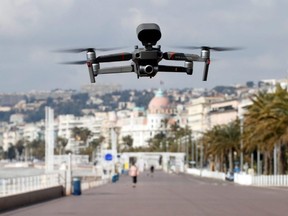 A drone, flying over the Promenade des Anglais, is used by French police reminding citizens of the COVID-19 coronavirus confinement measures in Nice, France, Friday, March 20, 2020.
