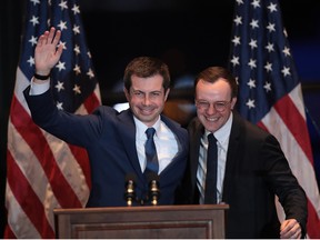 With his husband Chasten by his side, former South Bend, Indiana Mayor Pete Buttigieg announces he is ending campaign to be the Democratic nominee for president during a speech at the Century Center on March 1, 2020, in South Bend, Ind.