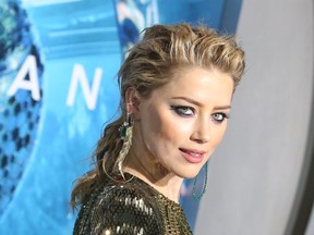 Amber Heard attends the Premiere Of Warner Bros. Pictures' "Aquaman".