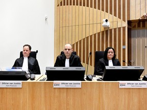Prosecutors Thijs Berger, Ward Ferdinandusse and Dedy Woei-a-Tsoi attend the criminal trial against four suspects in the July 2014 downing of Malaysia Airlines flight MH17, in Badhoevedorp, Netherlands, March 10, 2020.