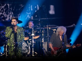 Adam Lambert (L) performs with Brian May of Queen during Fire Fight Australia at ANZ Stadium on Feb. 16, 2020 in Sydney, Australia.