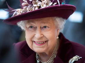 Queen Elizabeth II talks with MI5 officers during a visit to the headquarters of MI5 at Thames House in London Feb. 25, 2020. (Victoria Jones/PA Wire/Pool via REUTERS/File Photo)