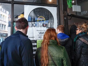 In this April 13, 2019, file photo, customers wait in line to enter the Shuga Records store during the Record Store Day in Chicago.